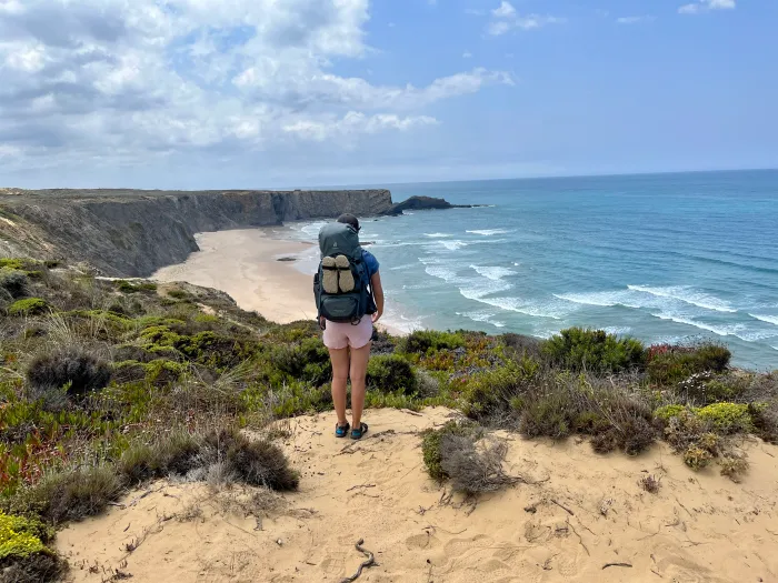 Aleks looking out onto the ocean from a cliff
